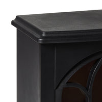 Close-up of the top corner of a black cabinet with smooth, decorative paneling—perfect for pairing with the Bromley Electric Fireplace 41x25.5x56.5cm, which features overheat protection for added safety and style.