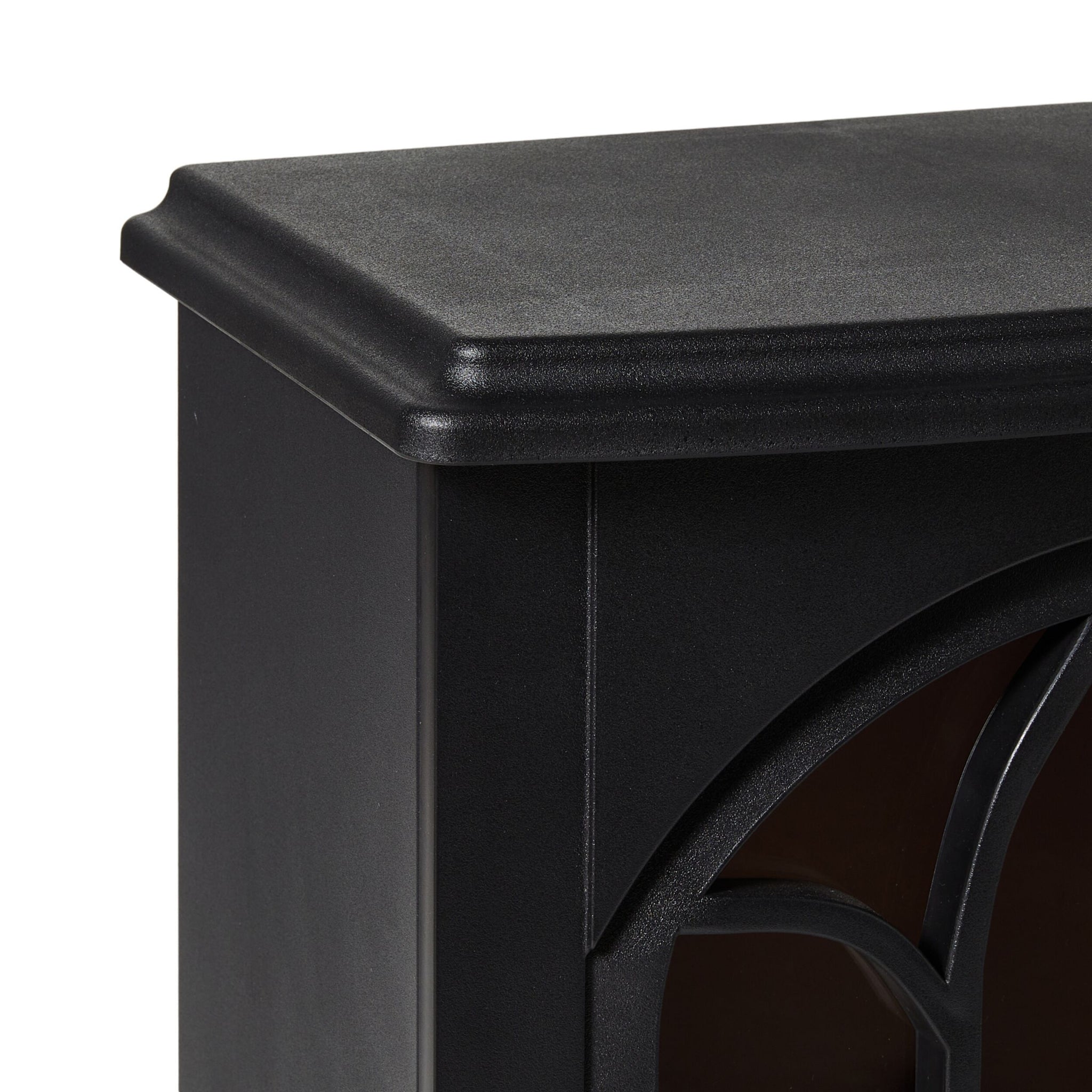 Close-up of the top corner of a black cabinet with smooth, decorative paneling—perfect for pairing with the Bromley Electric Fireplace 41x25.5x56.5cm, which features overheat protection for added safety and style.