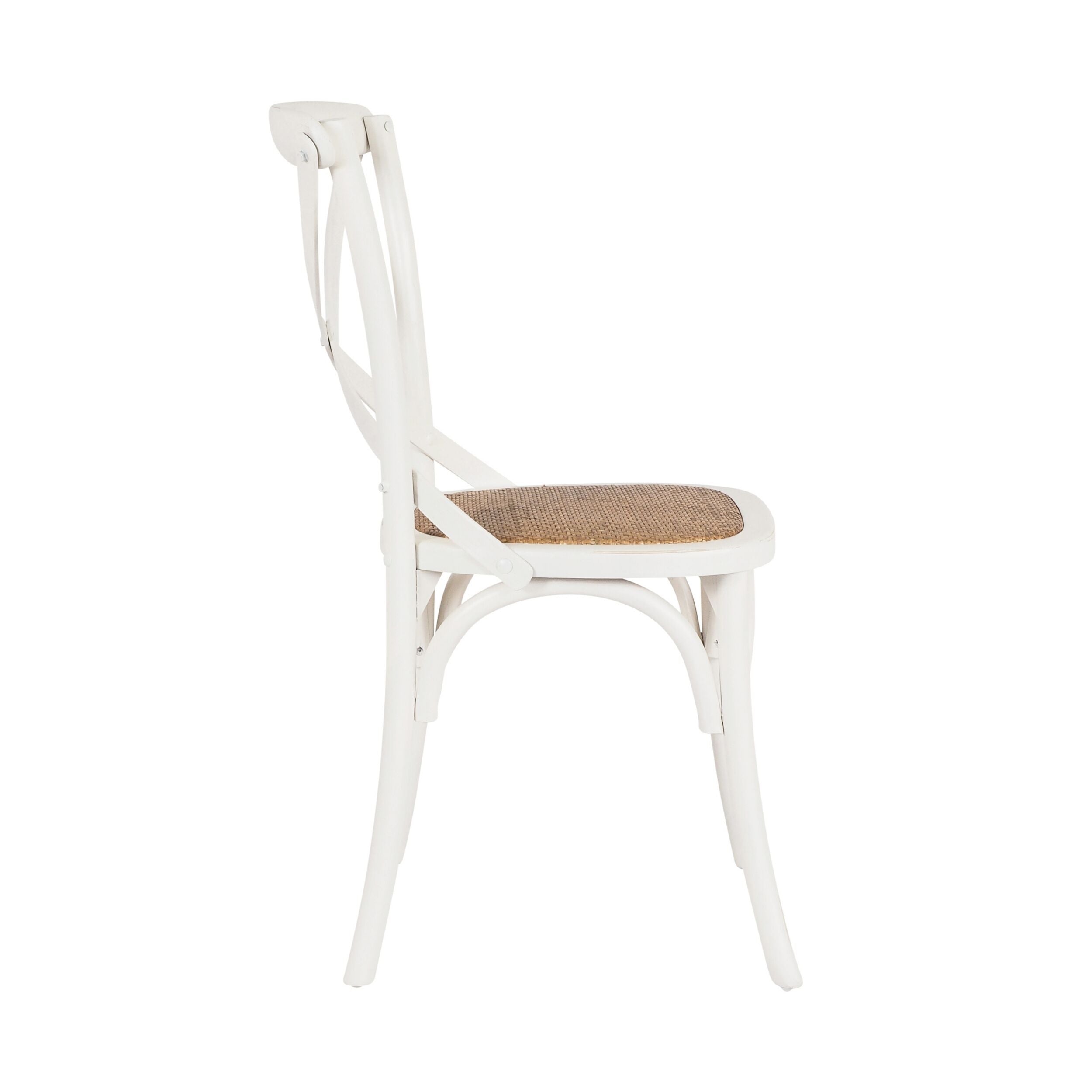 The Provincial Cross Back Dining Chair Crisp White features a woven wicker seat and showcases the Parisian chic style, beautifully displayed from the side against a pristine white background.