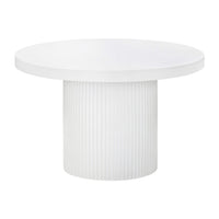 The Ripple Round Table 120cm features a smooth white concrete top and a wide, vertically grooved cylindrical base, making it an ideal four-seater for outdoor dining.