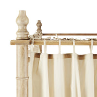 Close-up of a Hampton canopy bed highlighting the Hampton Cotton Voile Curtain - Set of 6 in beige, elegantly tied to the frame.