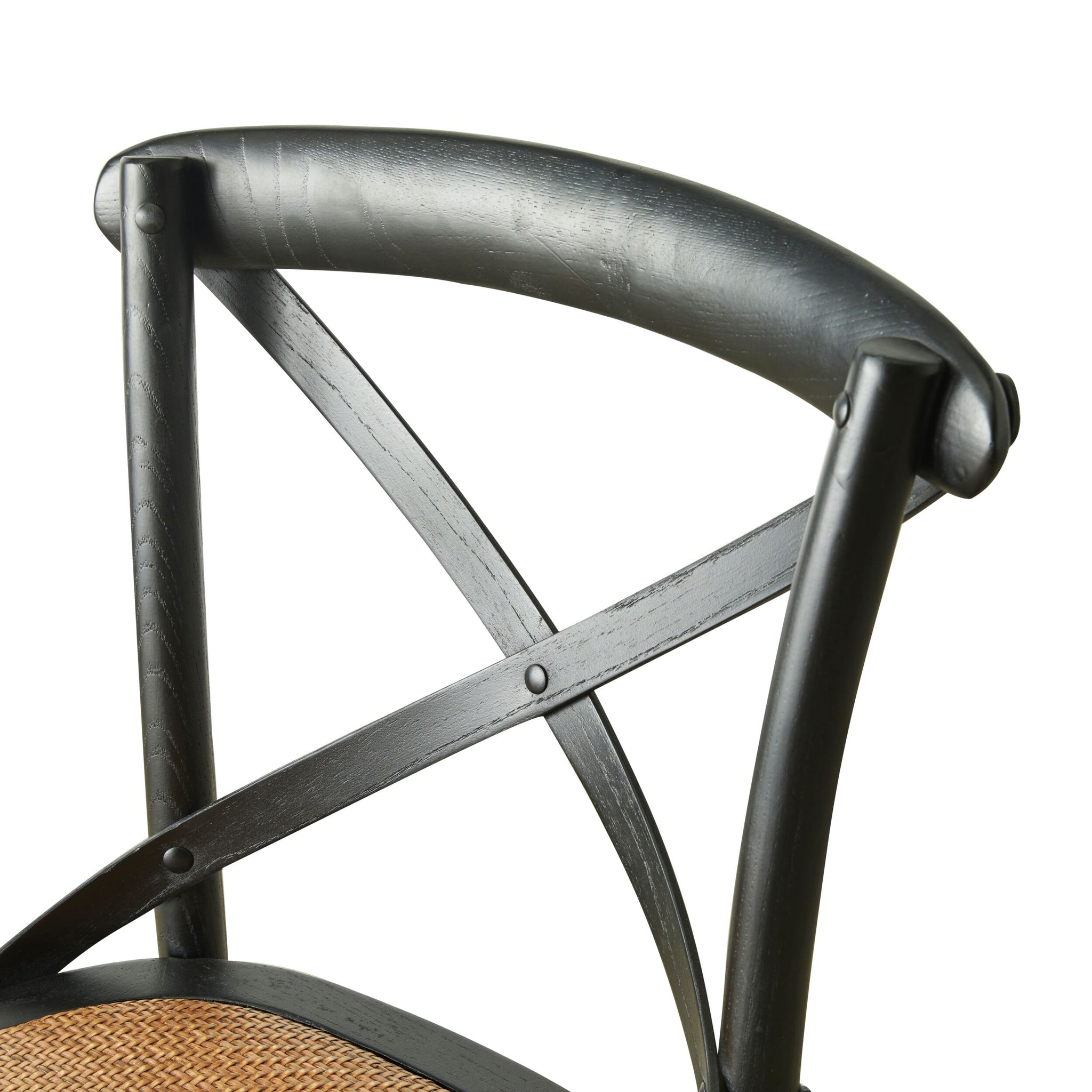 The Provincial Cross Back Dining Stool Black showcases a Parisian chic style with its black wooden frame, cross-back design, and cane seat, beautifully captured from a side angle.