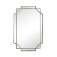 The Dominique Emerald Mirror Silver 90x60cm is a Deco-inspired rectangular wall mirror with beveled edges and a metallic frame featuring geometric corner accents, making it a striking statement piece.