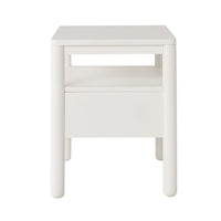 The Spintara 1 Drawer Bedside Table White, shown against a plain white background, features a coastal country style with rounded legs, an open shelf, and a lower drawer.