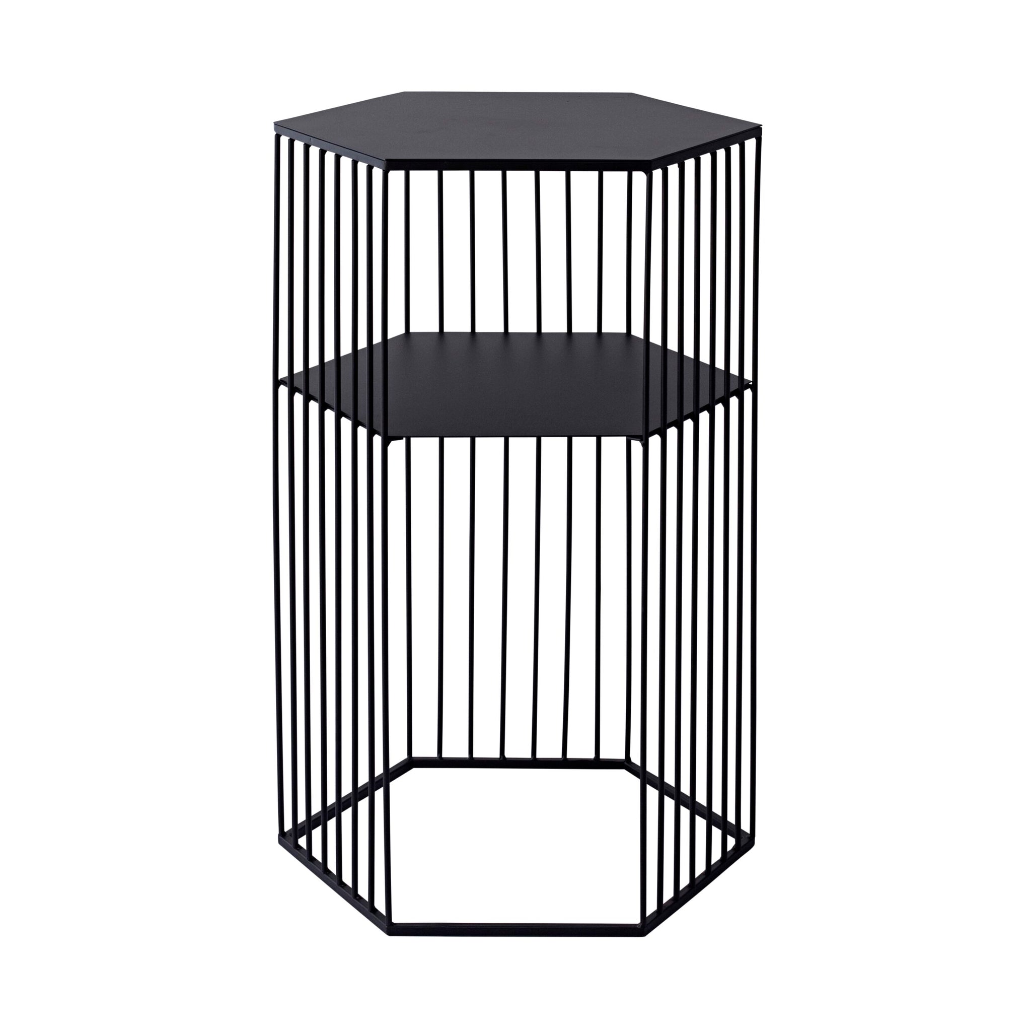 The Hendrix Bedside Table, a two-level hexagonal wireframe piece, features vertical black metal bars in a modern design. Made from black powder-coated iron, it serves as both a minimalist stool and stylish bedside table.