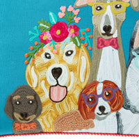 The Stitch Dogs Life Cushion (60x40cm) showcases exquisite embroidery with five dogs on a blue background: one wearing a flower crown, another sporting yellow glasses, and others adorned with bows and bow ties, contributing to its playful charm.