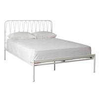 The Maya Queen Bed is a white iron frame with a minimalist vertical bar headboard, complemented by wooden slats. It features a powder-coated finish and includes a white mattress and two plush white pillows.