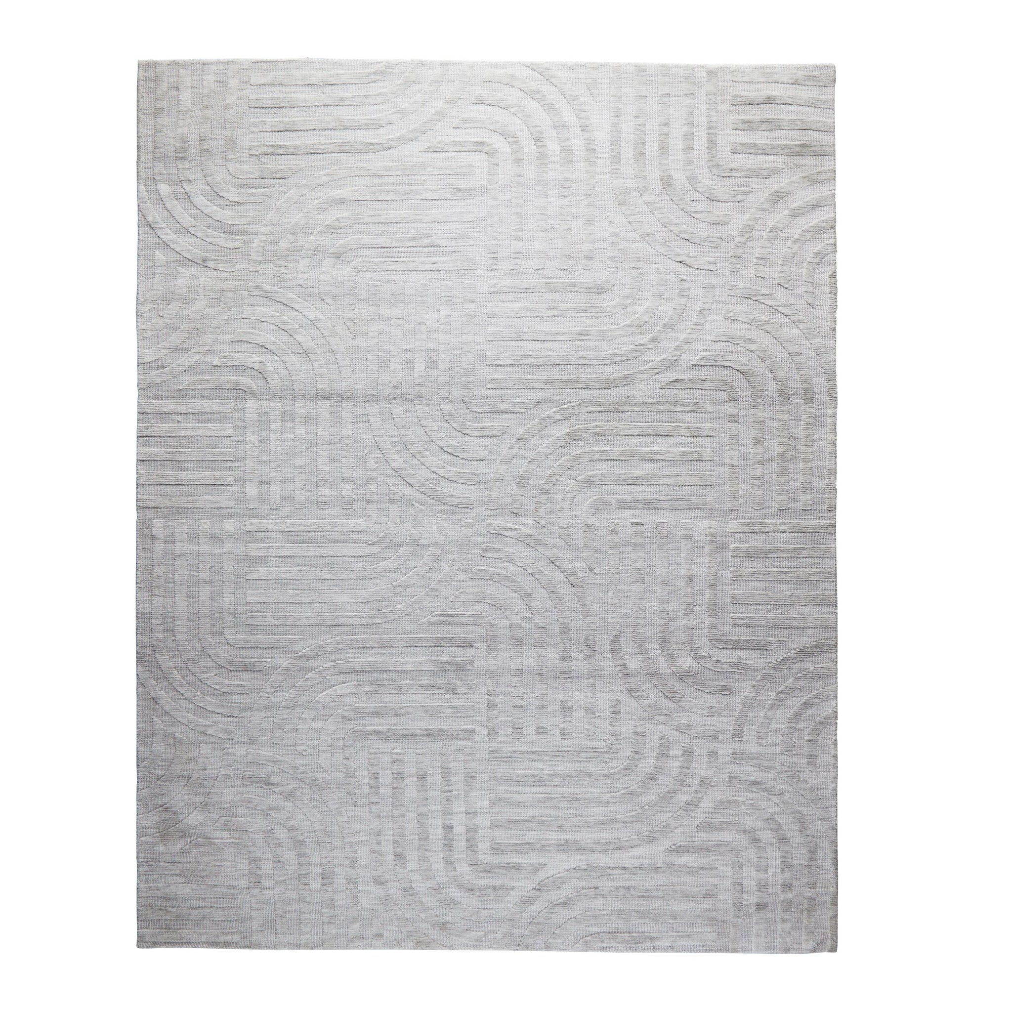 The Tufted Teal Jules Rug 300x240cm features a subtle geometric pattern of curved and straight lines, bringing understated Mid-Century style to any space.