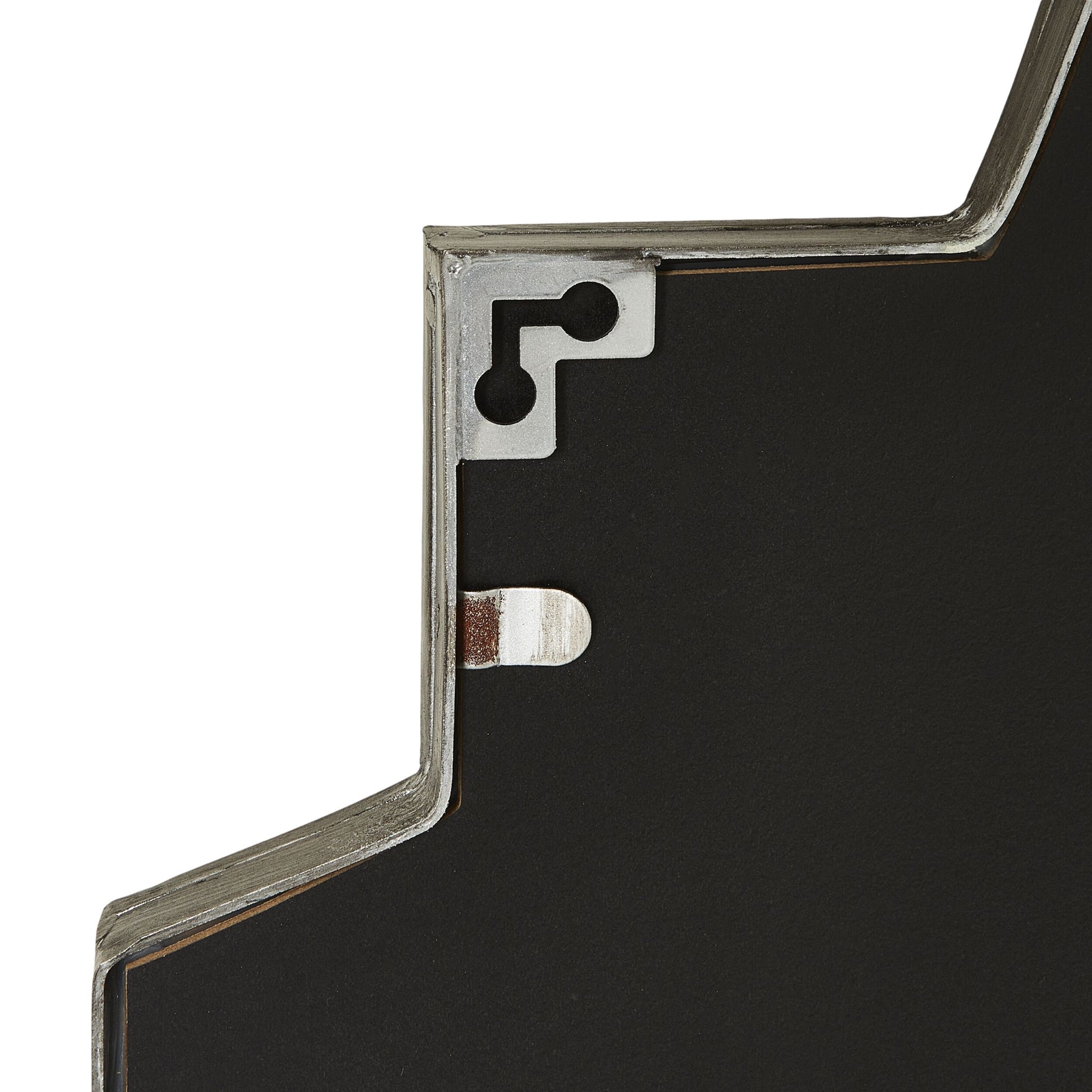 Close-up view of the Dominique Emerald Mirror Silver 90x60cm—an architectural statement piece with a Deco-inspired layered solid form, striking black surface, and exposed inner structure featuring metal and geometric cutouts.