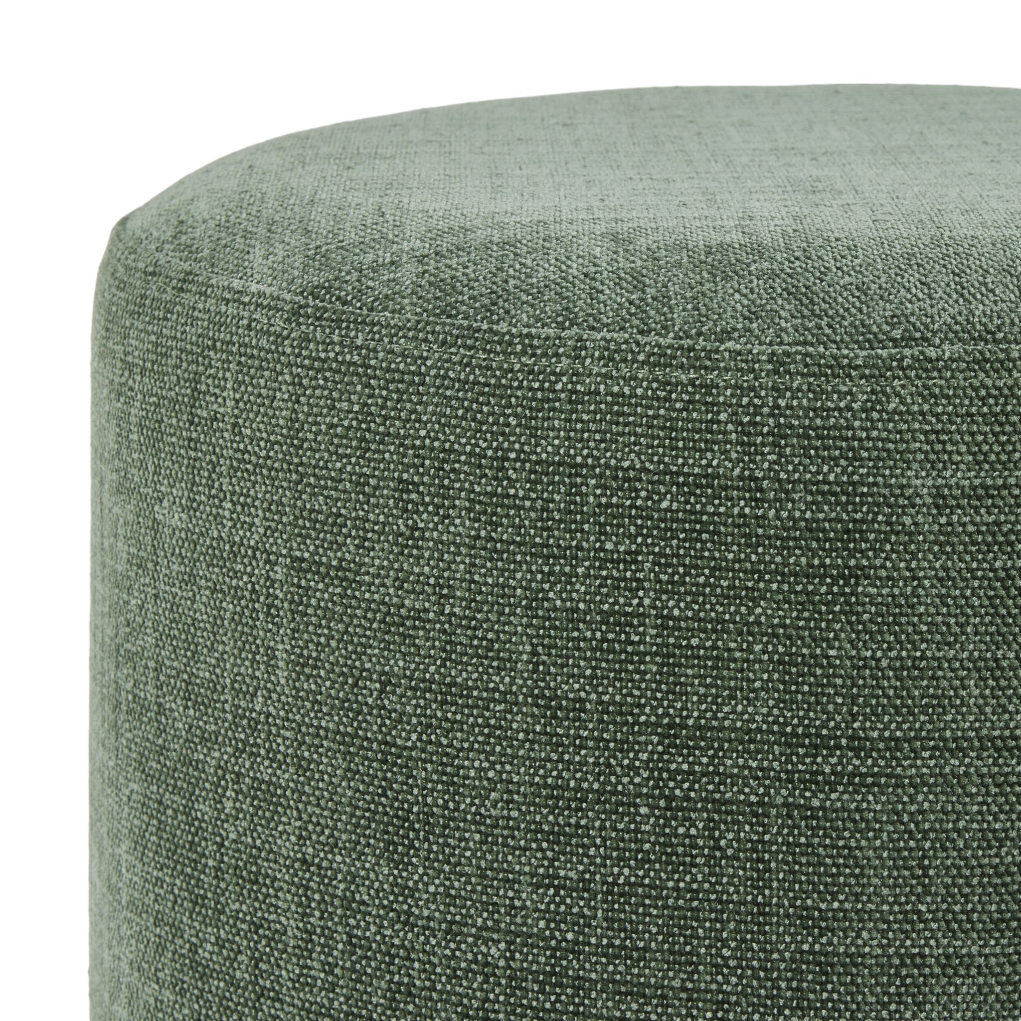 Close-up of the Edie Round Ottoman Solace Moss, showcasing durable textured polyester fabric in green, a rounded top, visible seam stitching, and versatile functionality.