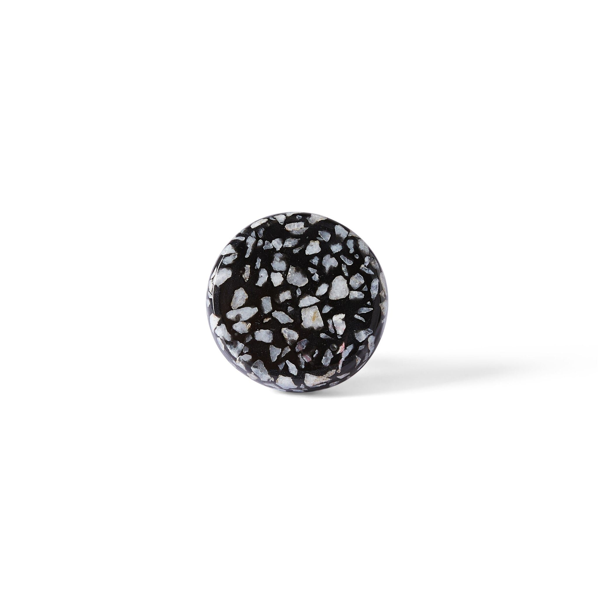 The Speckle Black and White Knob 4.4cm features a round shape with a terrazzo-inspired pattern, shown against a plain white background—an elegant accent for modern home decor.
