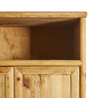 Close-up of the upper section of a Kalise 2 Door Wardrobe with an open shelf, highlighting the natural grain and knots in recycled pine wood.