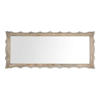 The Frieze Scalloped Edge Hand Carved Mirror, measuring 90x215cm, has a rectangular shape featuring a hand-carved wooden frame with wavy, scalloped edges.