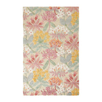 Introducing the Botanic Native Rug 240x150cm: a hand-tufted, rectangular masterpiece made from 100% wool, featuring a stunning floral design with pink, yellow, white flowers and lush green leaves on a soothing beige background.