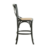 The Provincial Cross Back Dining Stool Black showcases a Parisian chic style with its side view featuring a wooden frame, curved backrest, woven seat, and footrest connecting the legs, embodying French Provincial design elegance.