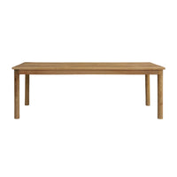 The Karli Dining Table 220cm, expertly crafted from durable mango wood, is a rectangular piece featuring four sturdy legs and a natural wood finish, comfortably accommodating 6-8 guests.