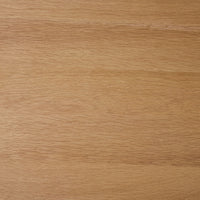 Close-up view of a light brown wooden surface with visible grain patterns and a smooth finish, similar to the craftsmanship of the Spintara 4 Drawer Chest Light Oak.