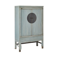 The Sansha Wedding Cabinet Dove Grey is a vintage-style cabinet in light blue, crafted from recycled pine wood. It features a circular black metal handle at the center with short legs and a Chinese antique style, boasting a slightly distressed finish.